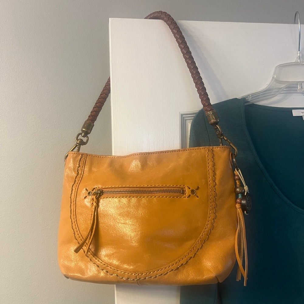 The Sak Leather Shoulder Bag with braided strap and tassle